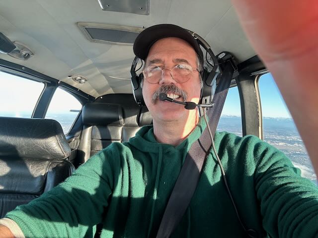 Krist flying plane.