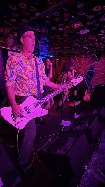 Krist playing bass.