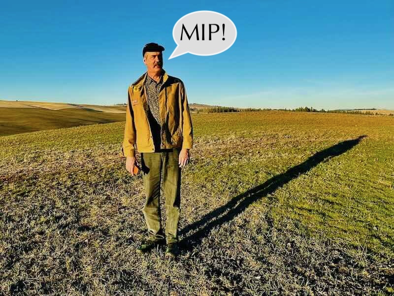 Krist in field saying PEACE!