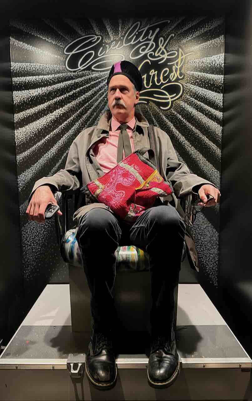 Regal looking Krist in barber chair.