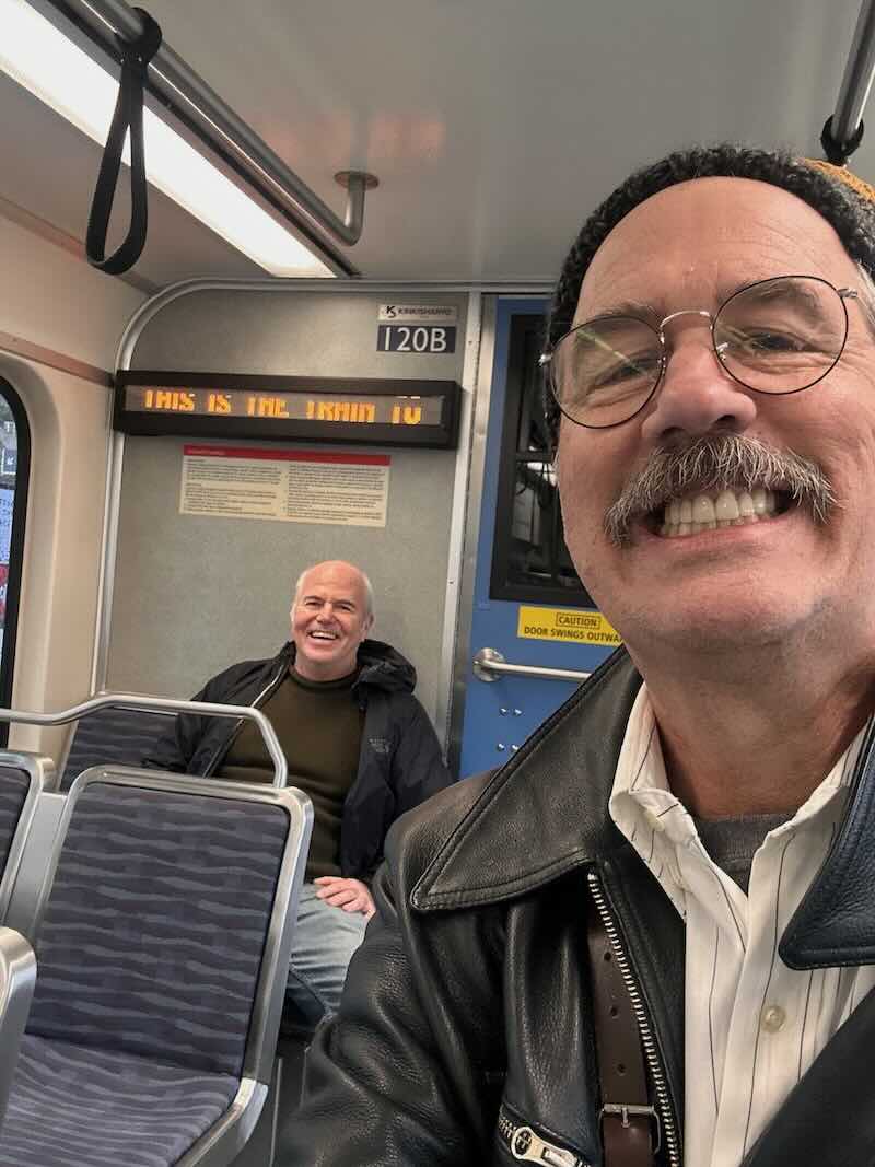 Krist with Bill Finkbeiner on light rail.