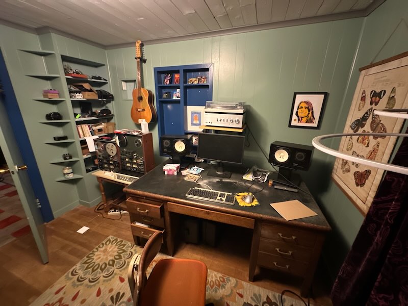 Room with desk & artwork.